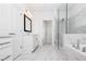 Luxurious primary bathroom with a walk-in shower, soaking tub, and a vanity at 711 Dodd N Ln # 166, Buford, GA 30518