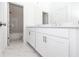 Bright bathroom with double sinks, vanity, marble flooring and a shower at 711 Dodd N Ln # 166, Buford, GA 30518