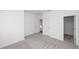 Neutral bedroom with carpet, light walls and multiple doors at 711 Dodd N Ln # 166, Buford, GA 30518