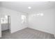 Neutral bedroom with carpet, two windows, and neutral colored walls at 711 Dodd N Ln # 166, Buford, GA 30518