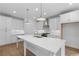 Bright kitchen with white cabinets, stainless steel appliances, and a center island at 711 Dodd N Ln # 166, Buford, GA 30518