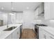 Kitchen features white cabinets, stainless steel appliances, and quartz counters at 711 Dodd N Ln # 166, Buford, GA 30518