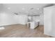 Bright open-concept living space with hardwood floors adjacent to the kitchen at 711 Dodd N Ln # 166, Buford, GA 30518