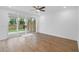 Bright living room with hardwood floors and sliding glass doors to the backyard at 711 Dodd N Ln # 166, Buford, GA 30518