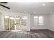 Bright living room with sliding glass doors leading to a covered patio at 711 Dodd N Ln # 166, Buford, GA 30518