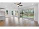 Open concept space featuring hardwood floors, recessed lighting and sliding glass doors at 711 Dodd N Ln # 166, Buford, GA 30518