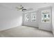 Spacious main bedroom with plush carpet, ceiling fan, and great natural light at 711 Dodd N Ln # 166, Buford, GA 30518