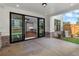 View of patio with large sliding glass doors to home interior and outdoor space at 711 Dodd N Ln # 166, Buford, GA 30518
