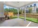 Covered patio with concrete floor and view of green lawn, fence, and retaining wall at 711 Dodd N Ln # 166, Buford, GA 30518