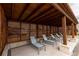 Relaxing poolside cabana with lounge chairs, side tables, and wood slat privacy, ideal for unwinding by the pool at 711 Dodd N Ln # 166, Buford, GA 30518