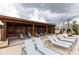 Relaxing poolside loungers under a wooden pergola offer a shaded retreat on a cloudy day at 711 Dodd N Ln # 166, Buford, GA 30518