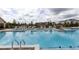 Large community swimming pool offers a refreshing escape with ample lounge chairs for residents at 711 Dodd N Ln # 166, Buford, GA 30518
