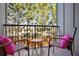 Relaxing outdoor balcony with comfortable seating and views of mature trees at 1199 Huff Nw Rd # 127, Atlanta, GA 30318