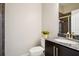 Compact bathroom with granite countertop sink and tiled shower, optimizing space and functionality at 1199 Huff Nw Rd # 127, Atlanta, GA 30318