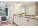 Bathroom with granite countertops, double sinks, and a view into the bedroom at 1199 Huff Nw Rd # 127, Atlanta, GA 30318