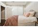 Bright bedroom showcasing a comfortable bed, light-filtering curtains, and elegant design details at 1199 Huff Nw Rd # 127, Atlanta, GA 30318
