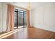 This luxurious room is light and bright and features a gorgeous chandelier, lovely trim and a walk out balcony at 1199 Huff Nw Rd # 127, Atlanta, GA 30318