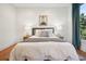 Well-lit bedroom showcases a plush bed, side tables with lamps, and modern decor at 1199 Huff Nw Rd # 127, Atlanta, GA 30318