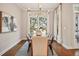Charming dining room features a modern chandelier, bright windows, and stylish decor at 1199 Huff Nw Rd # 127, Atlanta, GA 30318