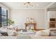 Open-concept living room with neutral tones, hardwood flooring, and large windows, creating an inviting space at 1199 Huff Nw Rd # 127, Atlanta, GA 30318