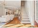 Open concept living room with hardwood floors flows into the kitchen with an island and stainless steel appliances at 1199 Huff Nw Rd # 127, Atlanta, GA 30318