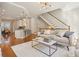 Bright living room boasts hardwood floors, opens to the kitchen and offers ample natural light and stylish decor at 1199 Huff Nw Rd # 127, Atlanta, GA 30318