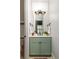 Stylish bathroom with a green vanity, a large mirror, and modern lighting fixtures and updated fixtures at 461 Bartram Se St # A, Atlanta, GA 30316