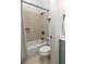 This bathroom features a tub with tile surround, a neutral color scheme, and updated fixtures at 461 Bartram Se St # A, Atlanta, GA 30316