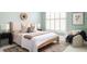 Tranquil bedroom with a neutral color palette, soft textures, and natural light, creating a relaxing space at 461 Bartram Se St # A, Atlanta, GA 30316