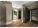 Walk in closet featuring dark wood cabinets, plenty of shelves and hardwood floors at 95 Grogans Lndg, Atlanta, GA 30350
