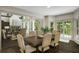 Bright dining area with access to deck featuring hardwood floors and modern decor at 95 Grogans Lndg, Atlanta, GA 30350