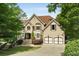 Stunning two-story home with a well-manicured lawn and attached two-car garage at 95 Grogans Lndg, Atlanta, GA 30350