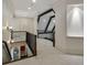 Upper hallway with hardwood railing and a view into a room with exposed ceiling beams at 95 Grogans Lndg, Atlanta, GA 30350