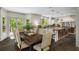 Open-concept kitchen features a large island, stainless steel appliances, and adjacent dining area with French doors at 95 Grogans Lndg, Atlanta, GA 30350