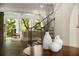Cozy living room with a fireplace and large windows offering scenic outdoor views at 95 Grogans Lndg, Atlanta, GA 30350