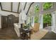 Bright living room with high ceilings, hardwood floors and an access to a deck at 95 Grogans Lndg, Atlanta, GA 30350