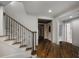 Entryway featuring a staircase, hardwood floors, and open access to other rooms at 95 Grogans Lndg, Atlanta, GA 30350