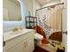 Well-lit bathroom featuring modern vanity, stylish mirror, and decorative shower curtain at 1320 Stanley Park Dr # 141, Decatur, GA 30033