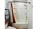 Bright bathroom featuring a tub with shower head and neutral-toned shower curtain at 1320 Stanley Park Dr # 141, Decatur, GA 30033