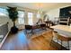 Bright dining room with hardwood flooring, a modern light fixture, and large windows at 1320 Stanley Park Dr # 141, Decatur, GA 30033