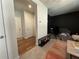 Hallway featuring wood floors, white walls, and access to living area at 1320 Stanley Park Dr # 141, Decatur, GA 30033
