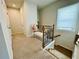 Hallway featuring carpeted floors, stairs with carpet, and neutral paint and bright ambient lighting at 1320 Stanley Park Dr # 141, Decatur, GA 30033