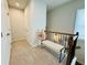 Upstairs hallway features a bench, carpet floors, white trim and doors at 1320 Stanley Park Dr # 141, Decatur, GA 30033