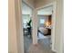 Hallway featuring an open doorway to a bedroom with carpeted floors and neutral paint at 1320 Stanley Park Dr # 141, Decatur, GA 30033