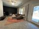 Inviting living room with plush seating, neutral carpet, and large windows at 1320 Stanley Park Dr # 141, Decatur, GA 30033