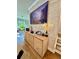 Contemporary living room with light wood floors, modern media center, and a scenic landscape art piece at 1320 Stanley Park Dr # 141, Decatur, GA 30033