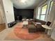 Bright living room with neutral carpet, plush sectional, and modern decor at 1320 Stanley Park Dr # 141, Decatur, GA 30033