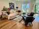 Bright living room with hardwood floors, a comfortable sectional sofa, stylish décor, and plenty of natural light at 1320 Stanley Park Dr # 141, Decatur, GA 30033