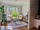 Cozy sitting room features a sitting area bathed in sunlight, a calm and inviting nook in the home at 1320 Stanley Park Dr # 141, Decatur, GA 30033