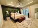 Spacious main bedroom featuring a canopy bed, decorative rug, and ample natural light at 1320 Stanley Park Dr # 141, Decatur, GA 30033